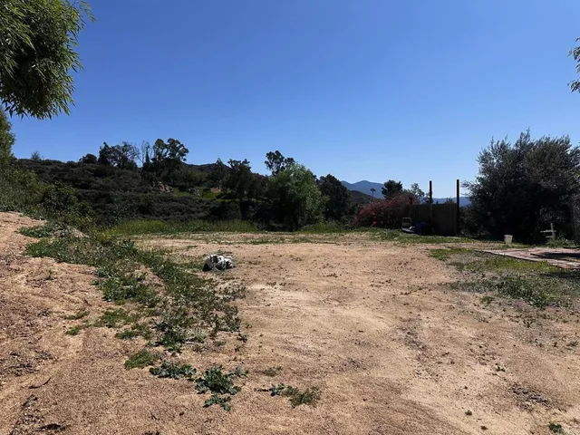 a view of a large mountain with a mountain in the background