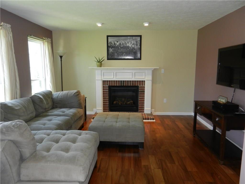 103 Teak Road Elizabeth, PA 15037 - Photo 3 of 19 Newly installed engineered hardwood, an elegant gas fireplace and plenty of room for furniture.