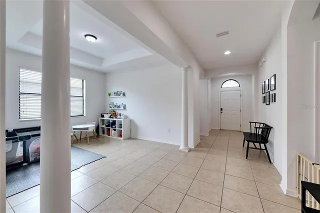 a view of a livingroom with workspace and a window