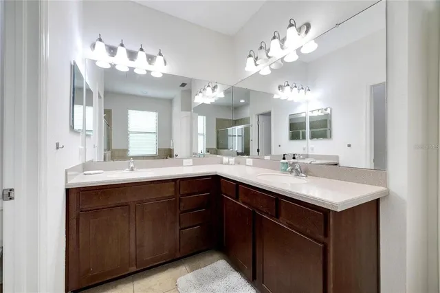 a kitchen with a sink and chandelier
