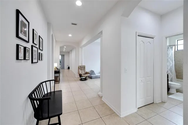 a view of a hallway with seating area