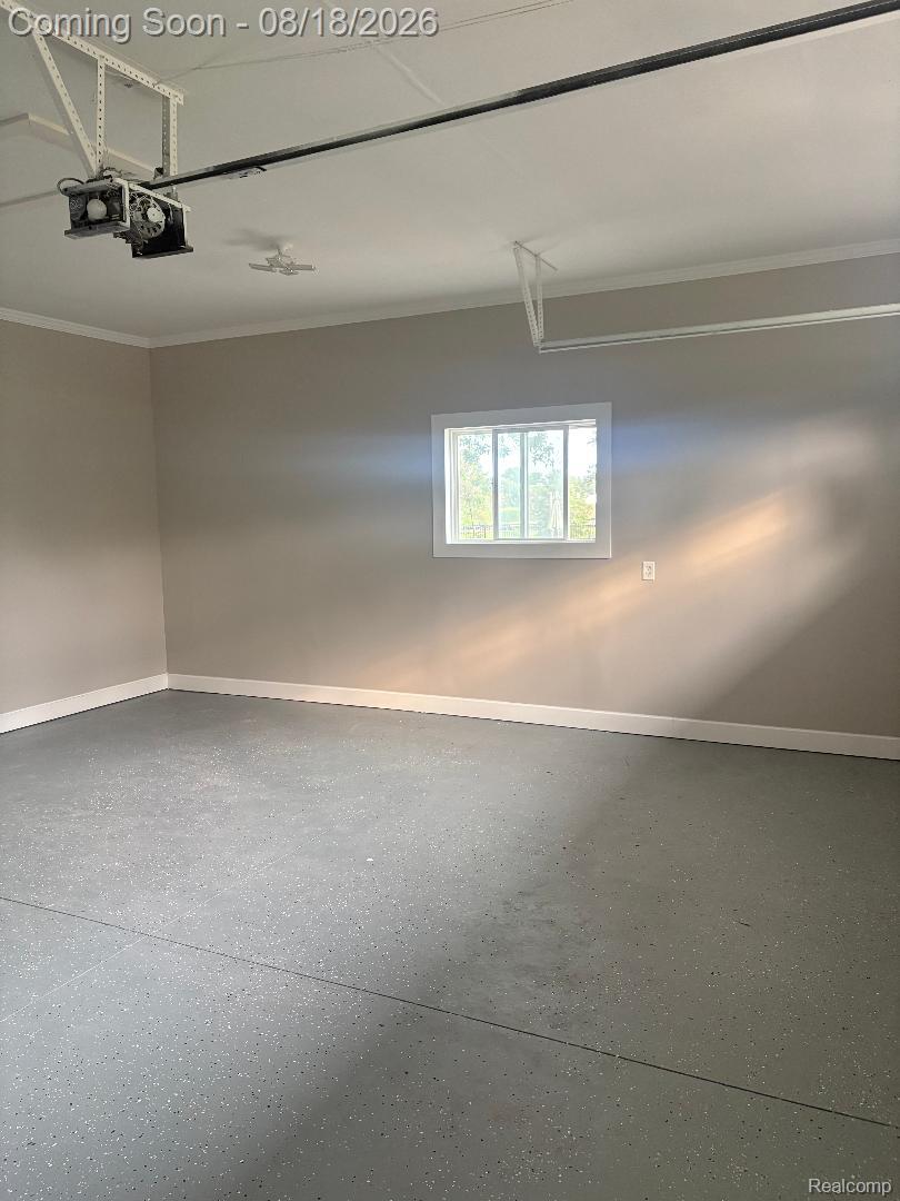 32563 Sutton Road New Baltimore, MI 48047 - Photo 40 of 43 Epoxy-coated flooring with neutral wall paint and white trim