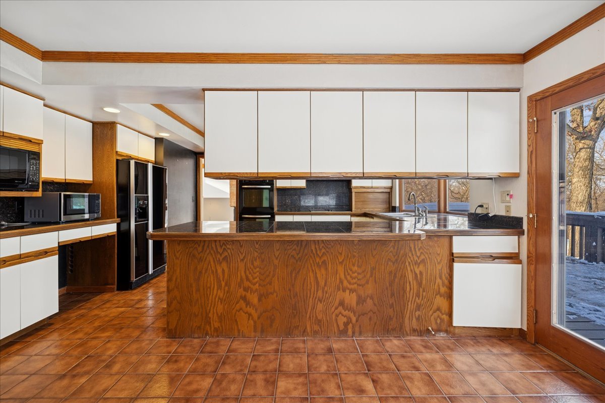 43W880 Pathfinder Drive Maple Park, IL 60151 - Photo 11 of 38 a kitchen with stainless steel appliances a refrigerator sink and cabinets