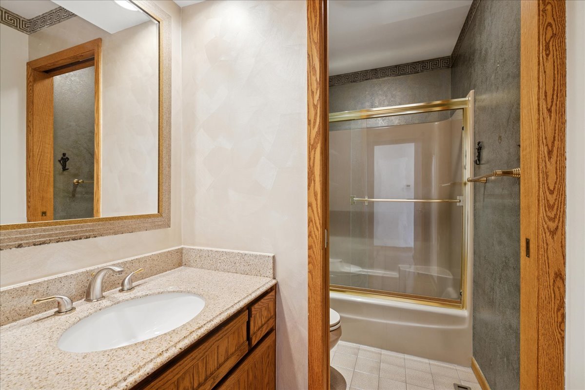 43W880 Pathfinder Drive Maple Park, IL 60151 - Photo 16 of 38 a bathroom with a granite countertop sink and a mirror
