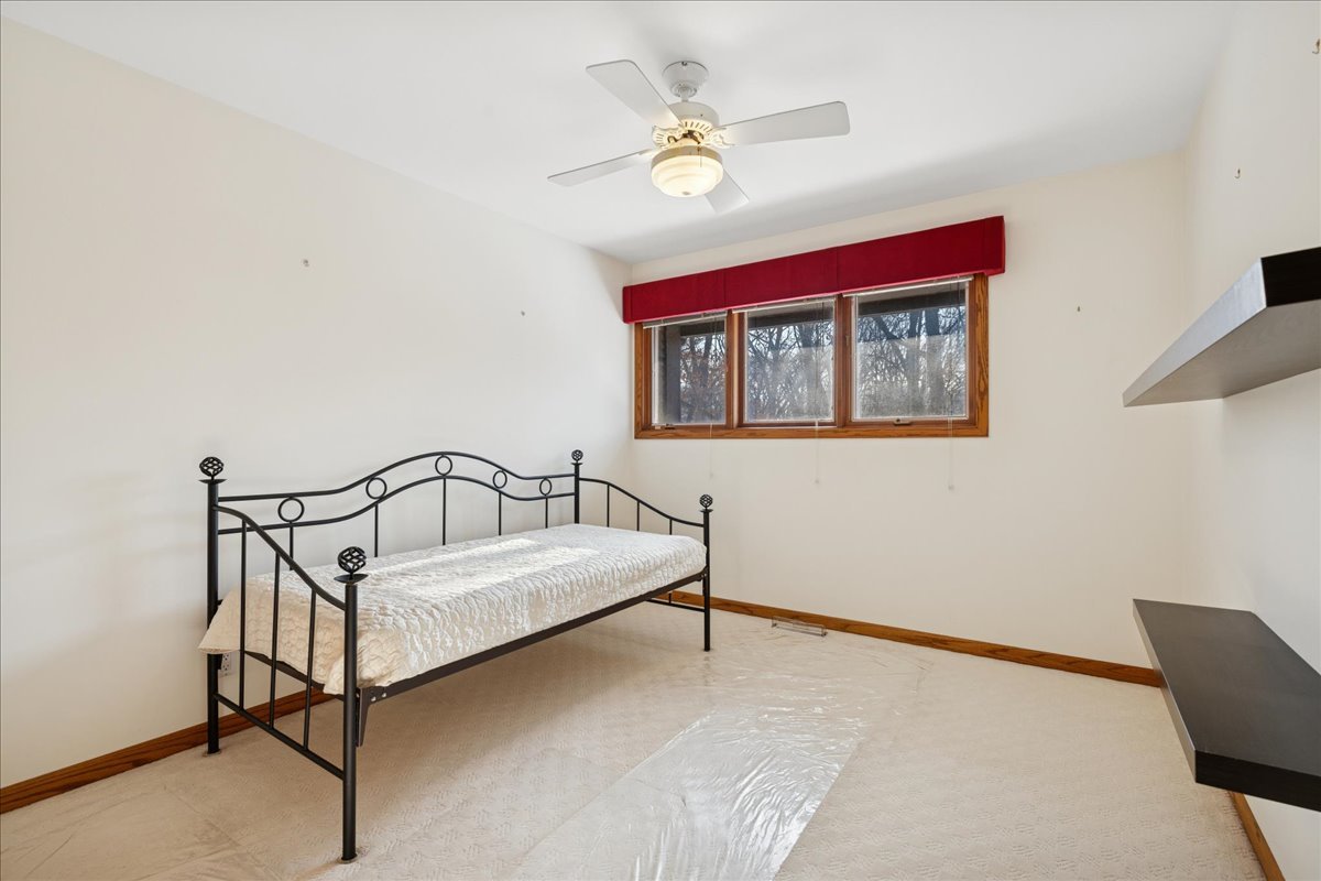 43W880 Pathfinder Drive Maple Park, IL 60151 - Photo 18 of 38 a white bed sitting in a bedroom next to a window