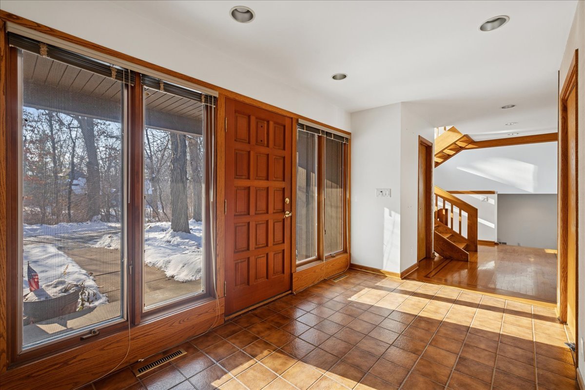43W880 Pathfinder Drive Maple Park, IL 60151 - Photo 2 of 38 a view of a room with wooden floor and a sliding door