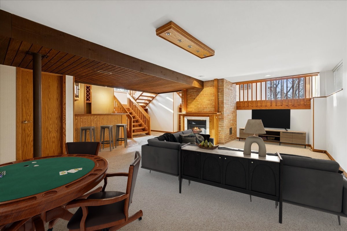 43W880 Pathfinder Drive Maple Park, IL 60151 - Photo 25 of 38 a living room with furniture a flat screen tv and a floor to ceiling window