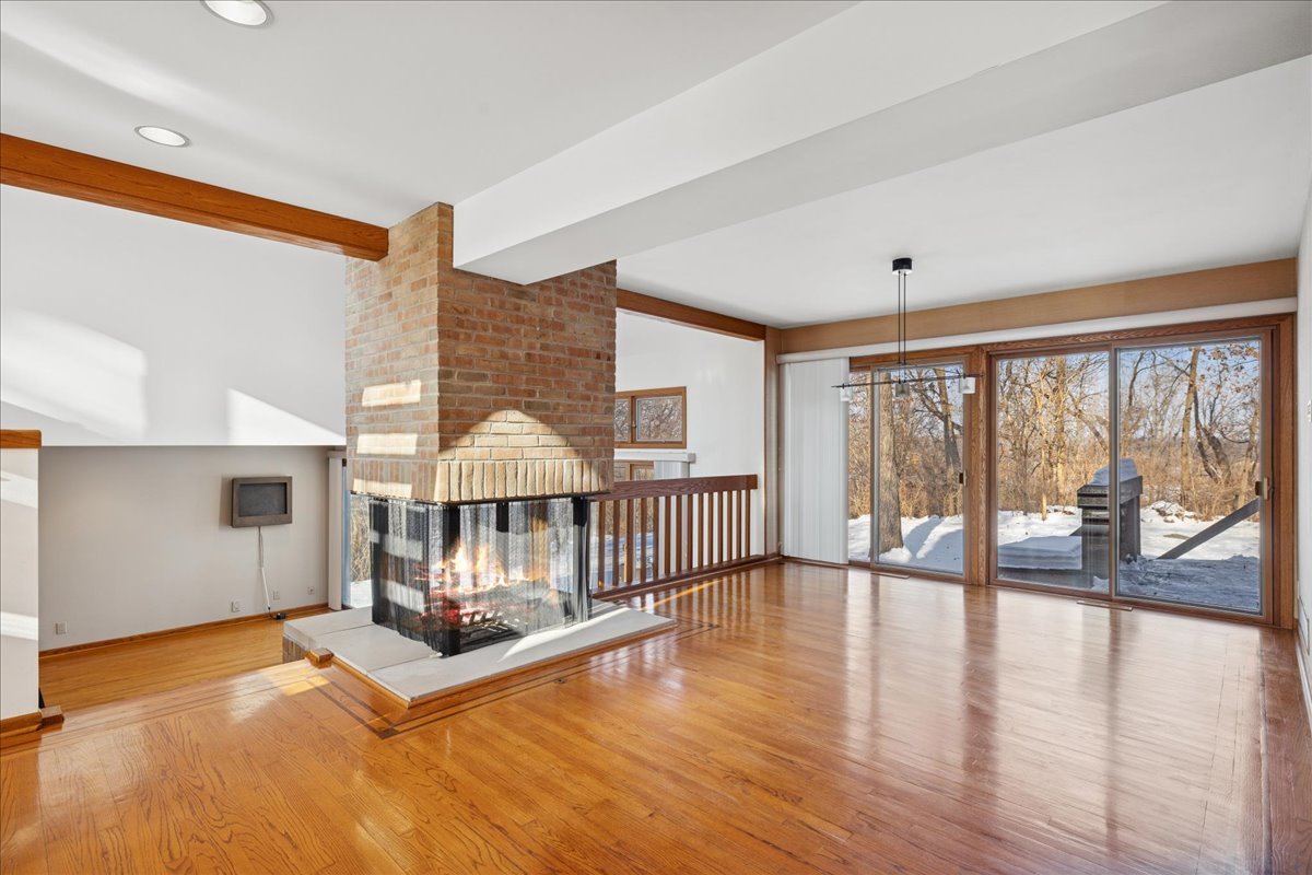 43W880 Pathfinder Drive Maple Park, IL 60151 - Photo 3 of 38 a view of a livingroom with furniture wooden floor and windows