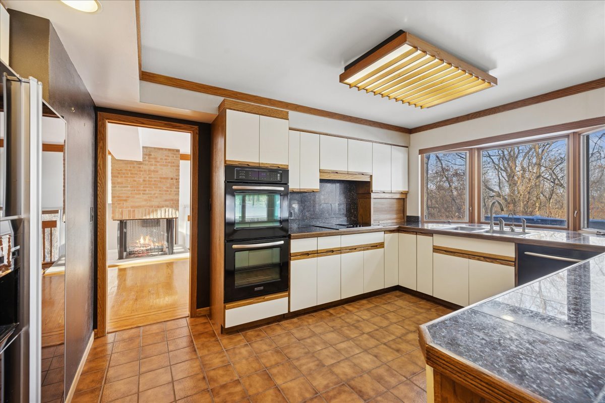 43W880 Pathfinder Drive Maple Park, IL 60151 - Photo 8 of 38 a kitchen with stainless steel appliances granite countertop a refrigerator stove and sink