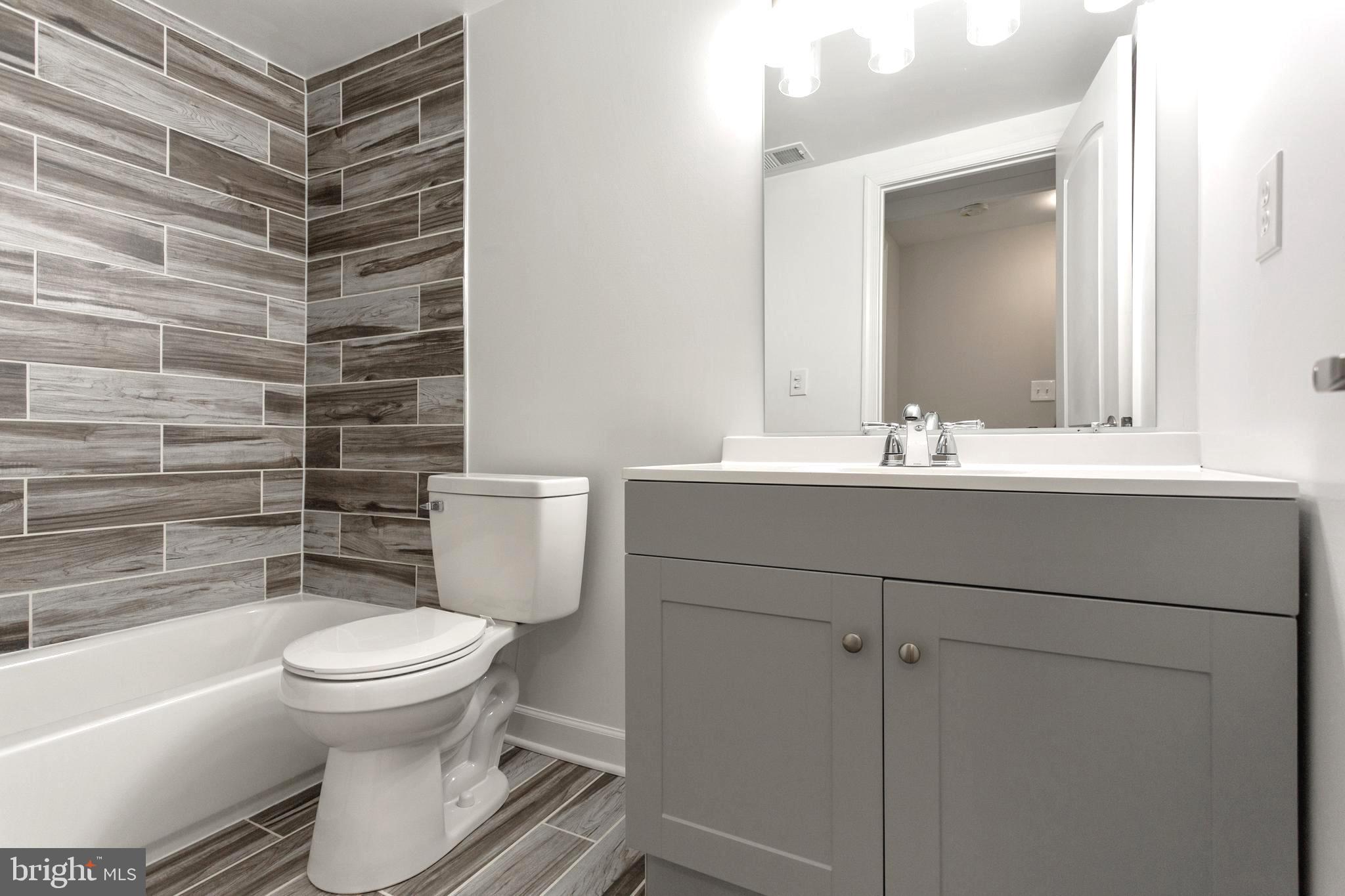 2087 Park Trail Road Windsor Mill, MD 21244 - Photo 21 of 32 Upstairs 2nd Bathroom- Ceramic tile and tub/shower