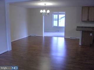94 Harvard Road Pennsville, NJ 08070 - Photo 5 of 6 wooden floor in an empty room with a window