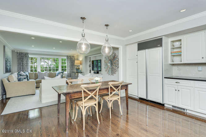 110 Meadow Road Riverside, CT 06878 - Photo 14 of 38 a view of a dining room with furniture window and wooden floor