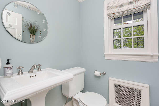 110 Meadow Road Riverside, CT 06878 - Photo 18 of 38 a bathroom with a sink and a mirror
