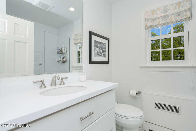 110 Meadow Road Riverside, CT 06878 - Photo 25 of 38 a bathroom with a sink toilet and a window