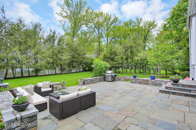 110 Meadow Road Riverside, CT 06878 - Photo 33 of 38 a view of a patio with a table and chairs