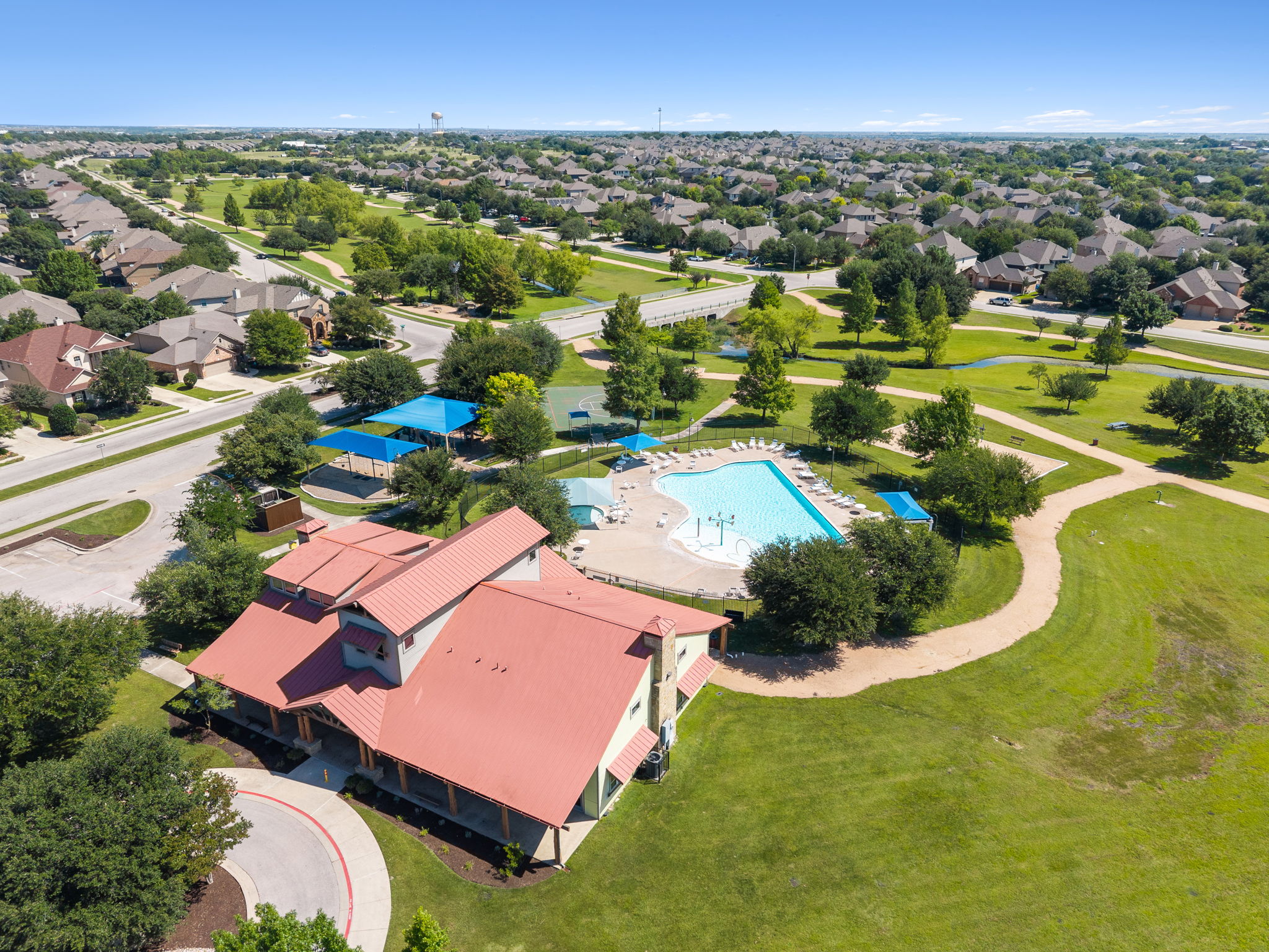 3101 Fresh Spring Road Pflugerville, TX 78660 - Photo 31 of 39 Community amenity center for residents has a pool, shaded play areas and clubhouse