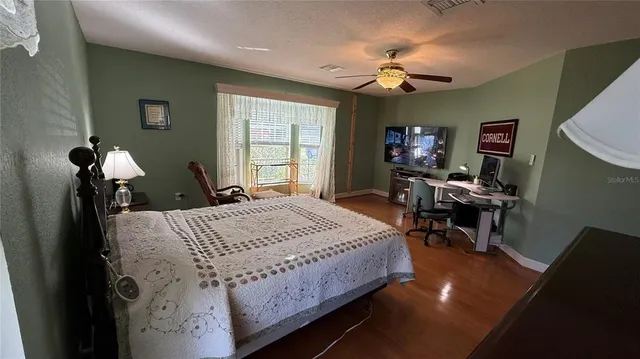 a bed room with a bed and a chandelier
