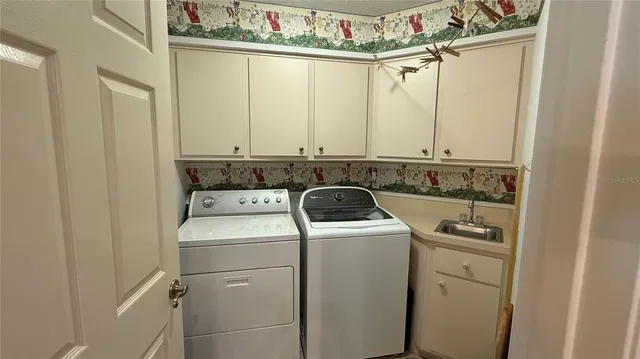a utility room with dryer and washer