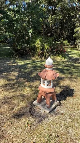 a view of a wooden fence with some trees