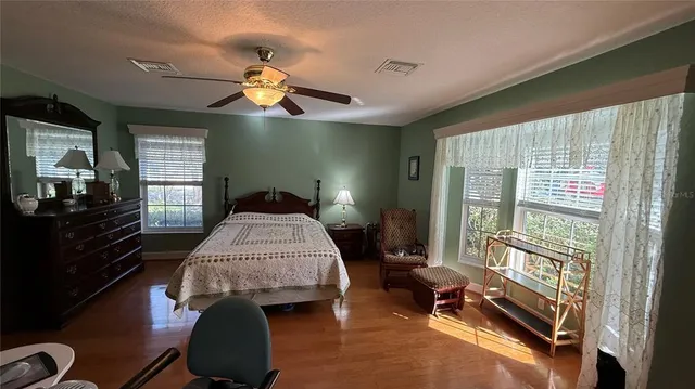 a bedroom with bed and a window