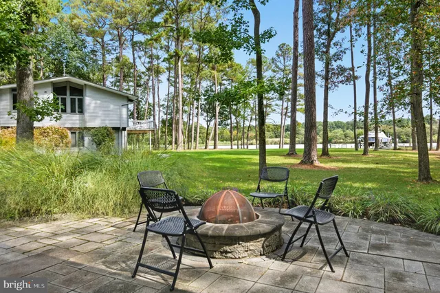 a swimming pool view with a outdoor seating
