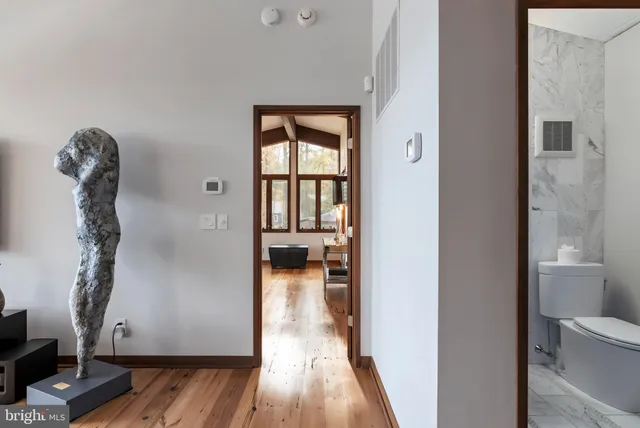 a view of balcony with furniture and wooden floor