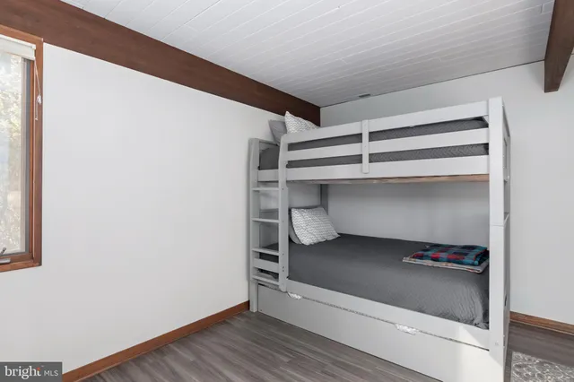 an aerial view of a houses with a yard