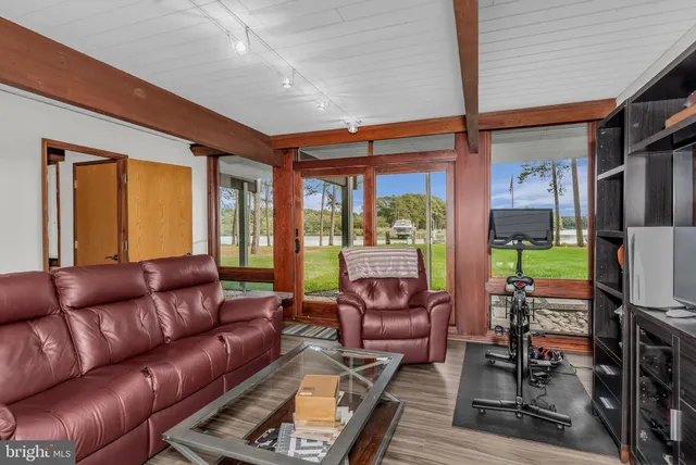 a small pool with outdoor seating and yard