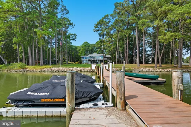 a view of backyard with seating and green space