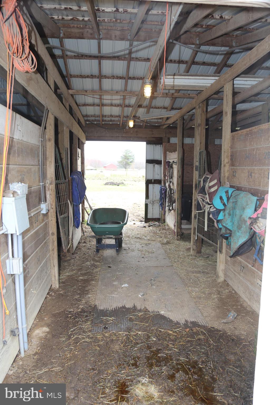 16873 Henderson Road Henderson, MD 21640 - Photo 43 of 45 Center isle of main barn leading out to the riding