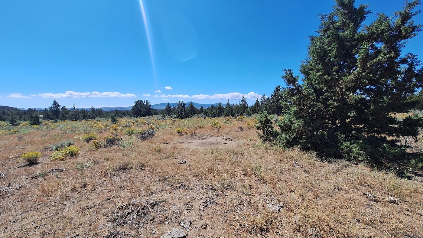 400 Goldenview Ranch Bend, Unit 400 Bend, OR 97701 - Photo 5 of 8 a view of a lake with mountains in the background