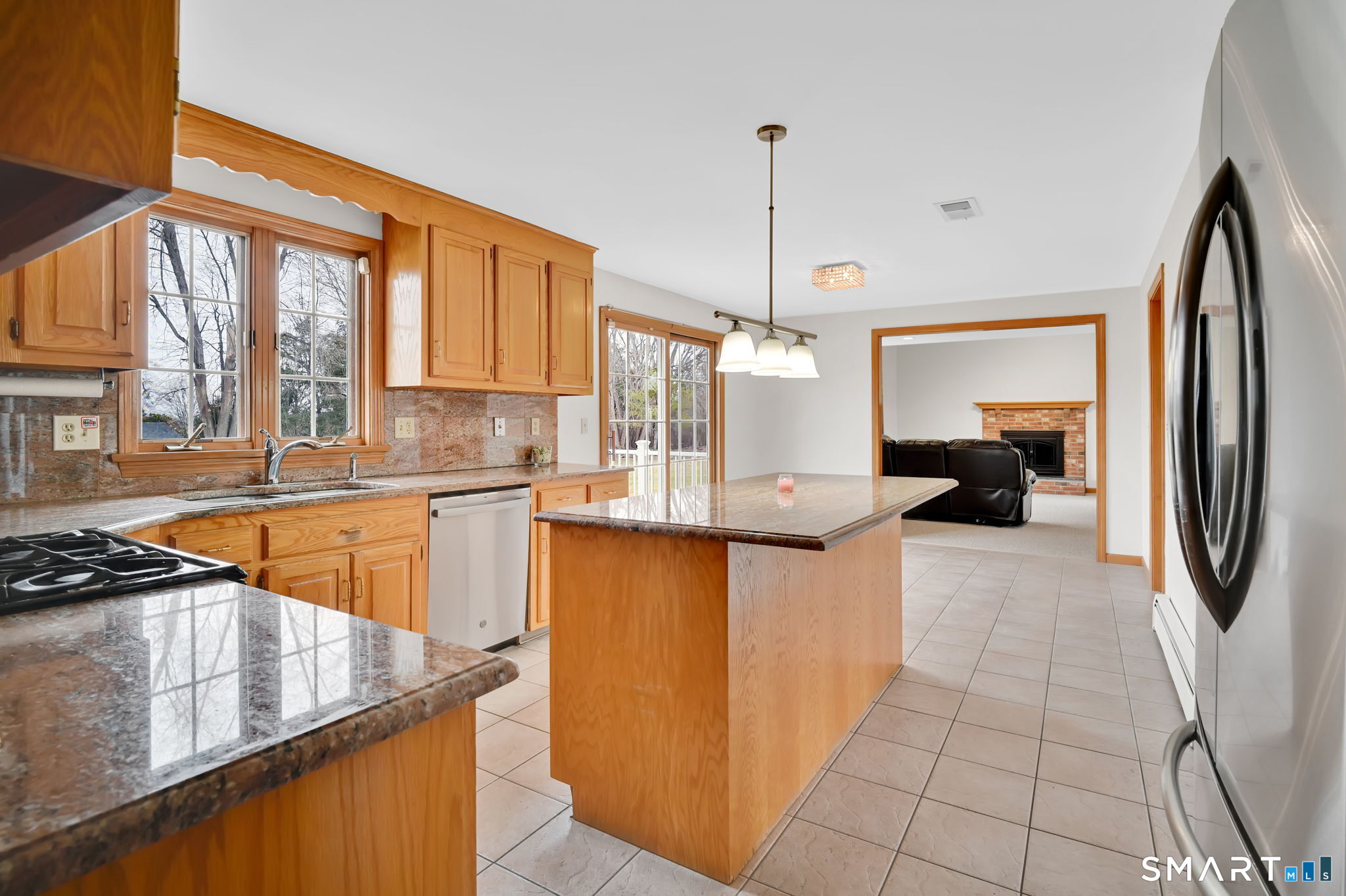 36 Cardinal Way South Windsor, CT 06074 - Photo 11 of 40 a kitchen with stainless steel appliances granite countertop a refrigerator a sink dishwasher a stove and white cabinets with wooden floor