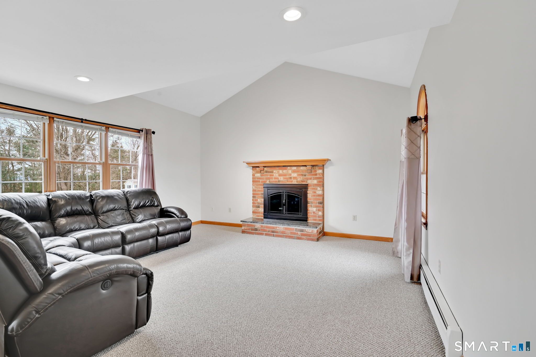 36 Cardinal Way South Windsor, CT 06074 - Photo 13 of 40 a living room with furniture and a fireplace