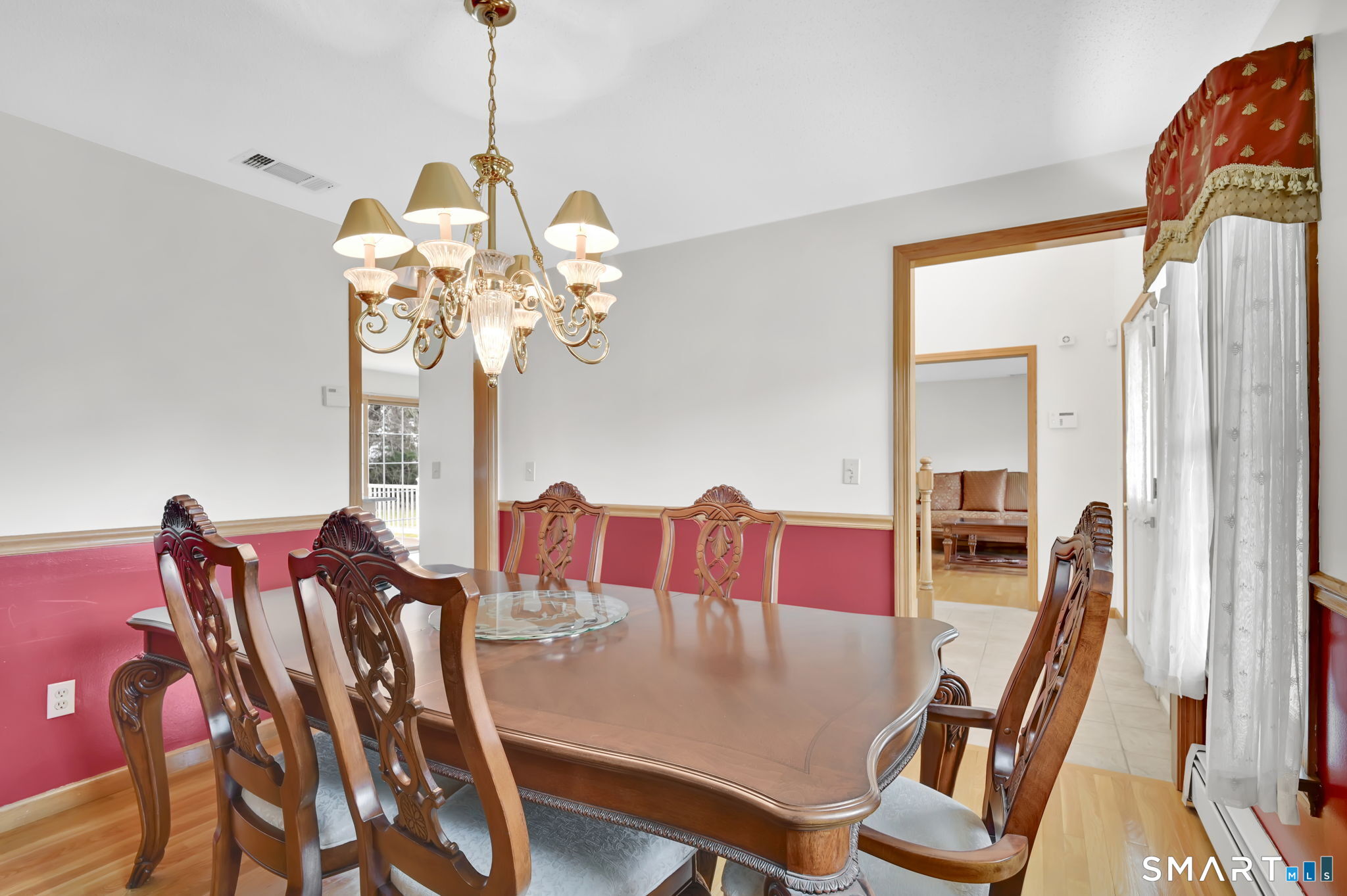 36 Cardinal Way South Windsor, CT 06074 - Photo 16 of 40 a view of a dining room with furniture and a chandelier