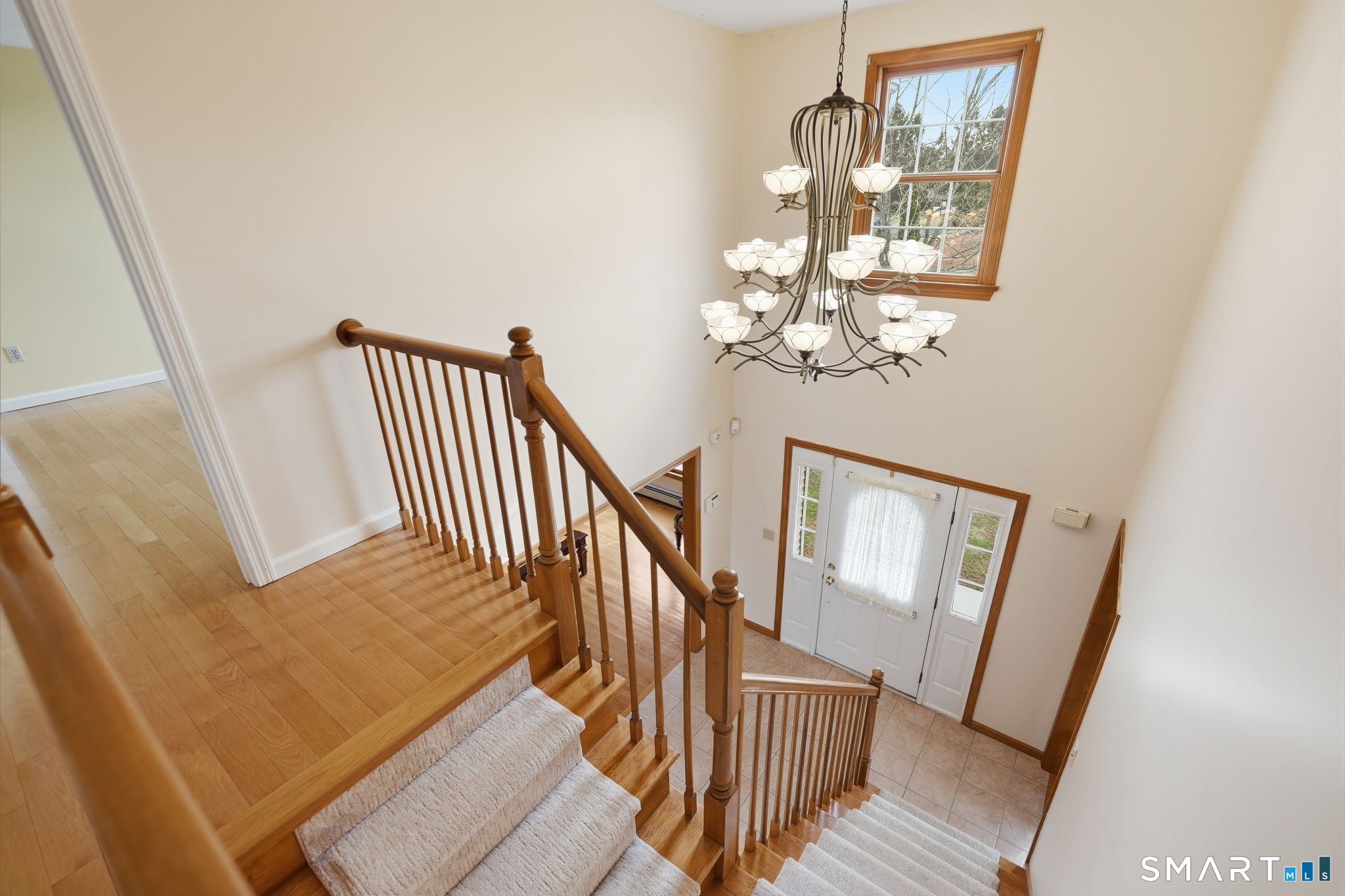 36 Cardinal Way South Windsor, CT 06074 - Photo 21 of 40 wooden floor with windows and stairs