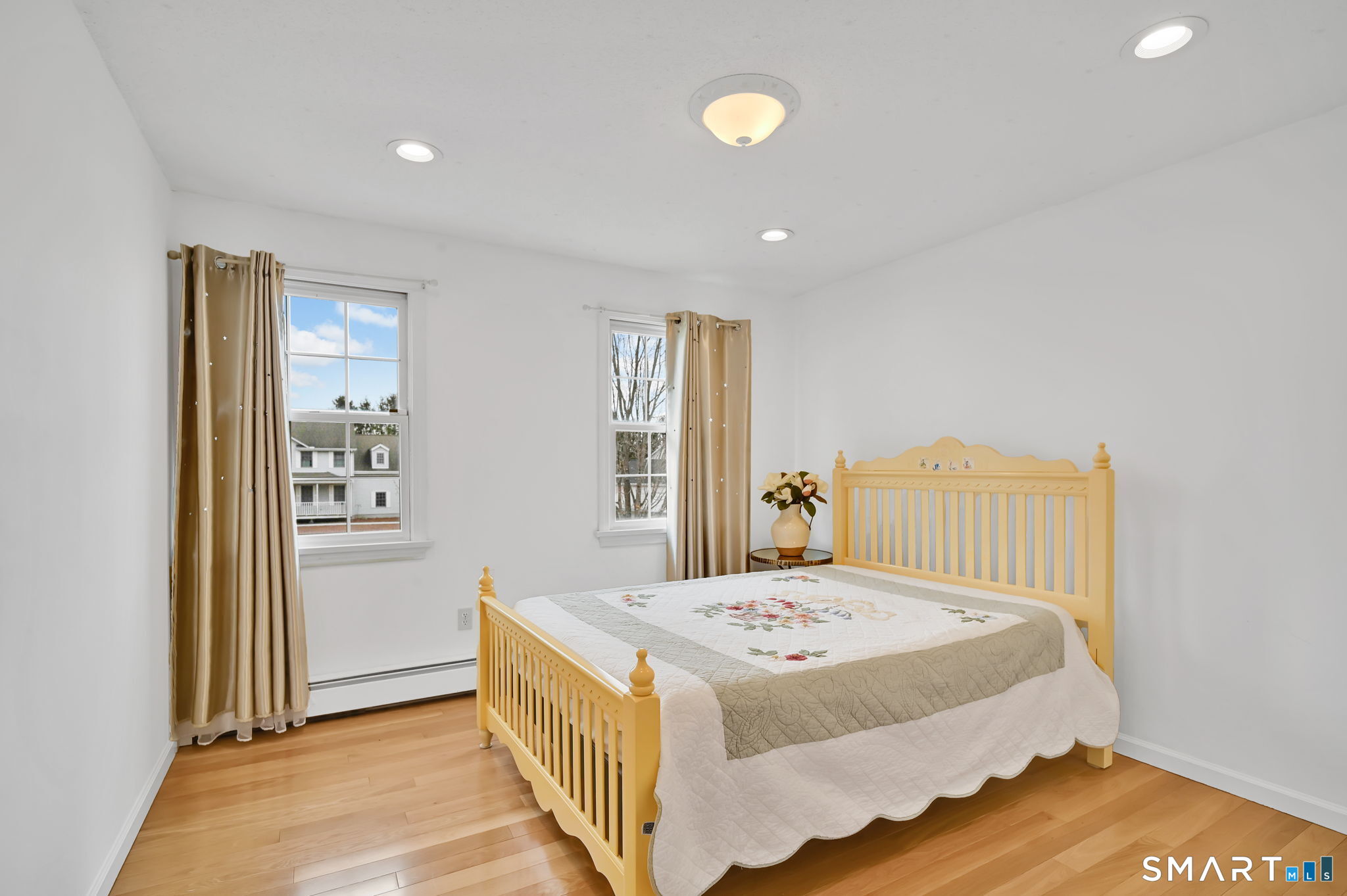 36 Cardinal Way South Windsor, CT 06074 - Photo 28 of 40 a view of a bedroom with wooden floor and windows
