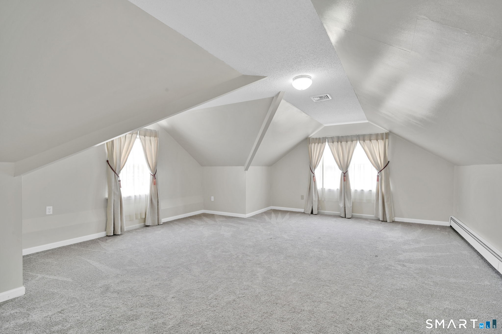 36 Cardinal Way South Windsor, CT 06074 - Photo 30 of 40 an empty room with windows and chandelier fan