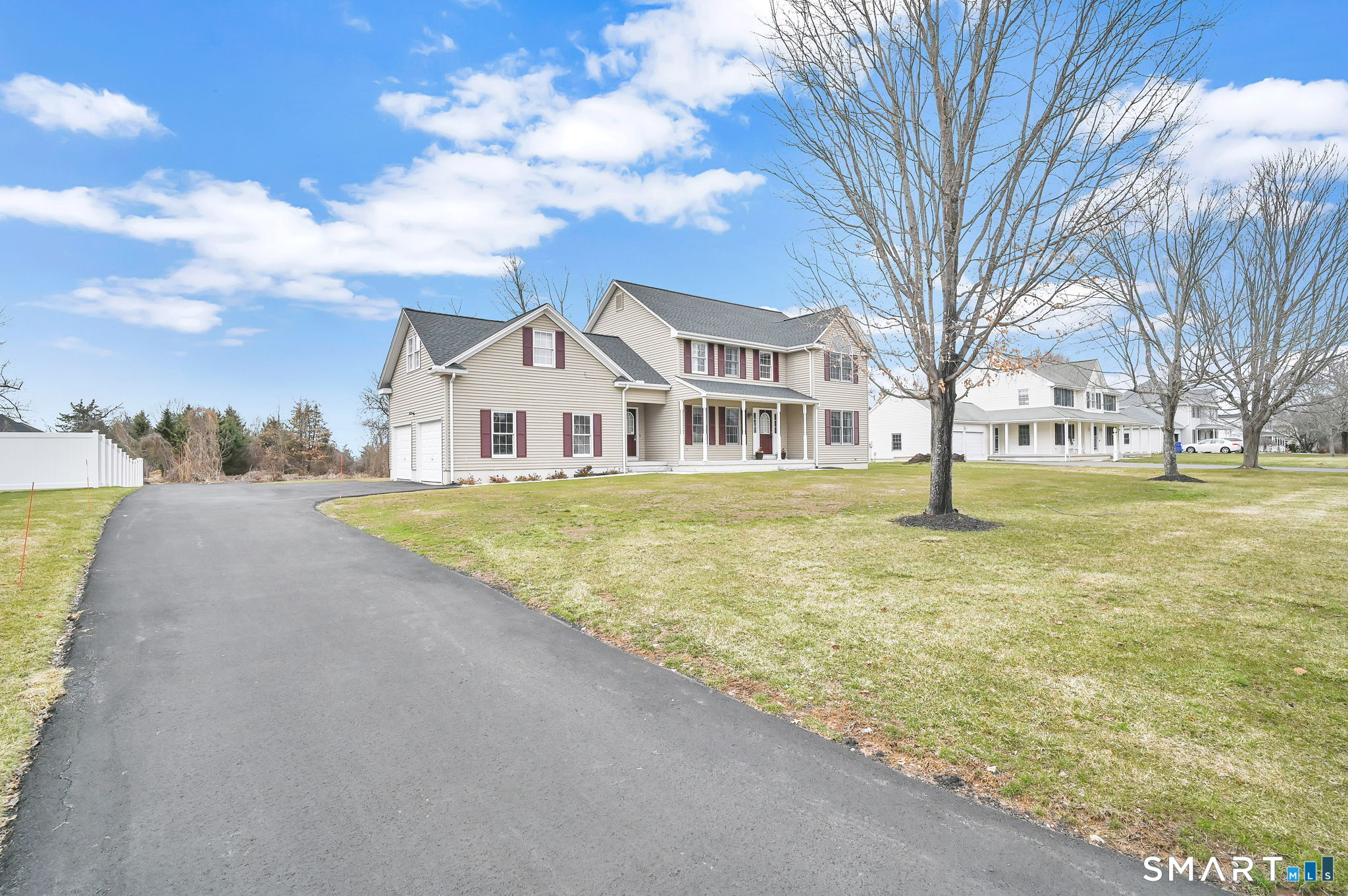 36 Cardinal Way South Windsor, CT 06074 - Photo 40 of 40 a view of a white house with a yard and garage