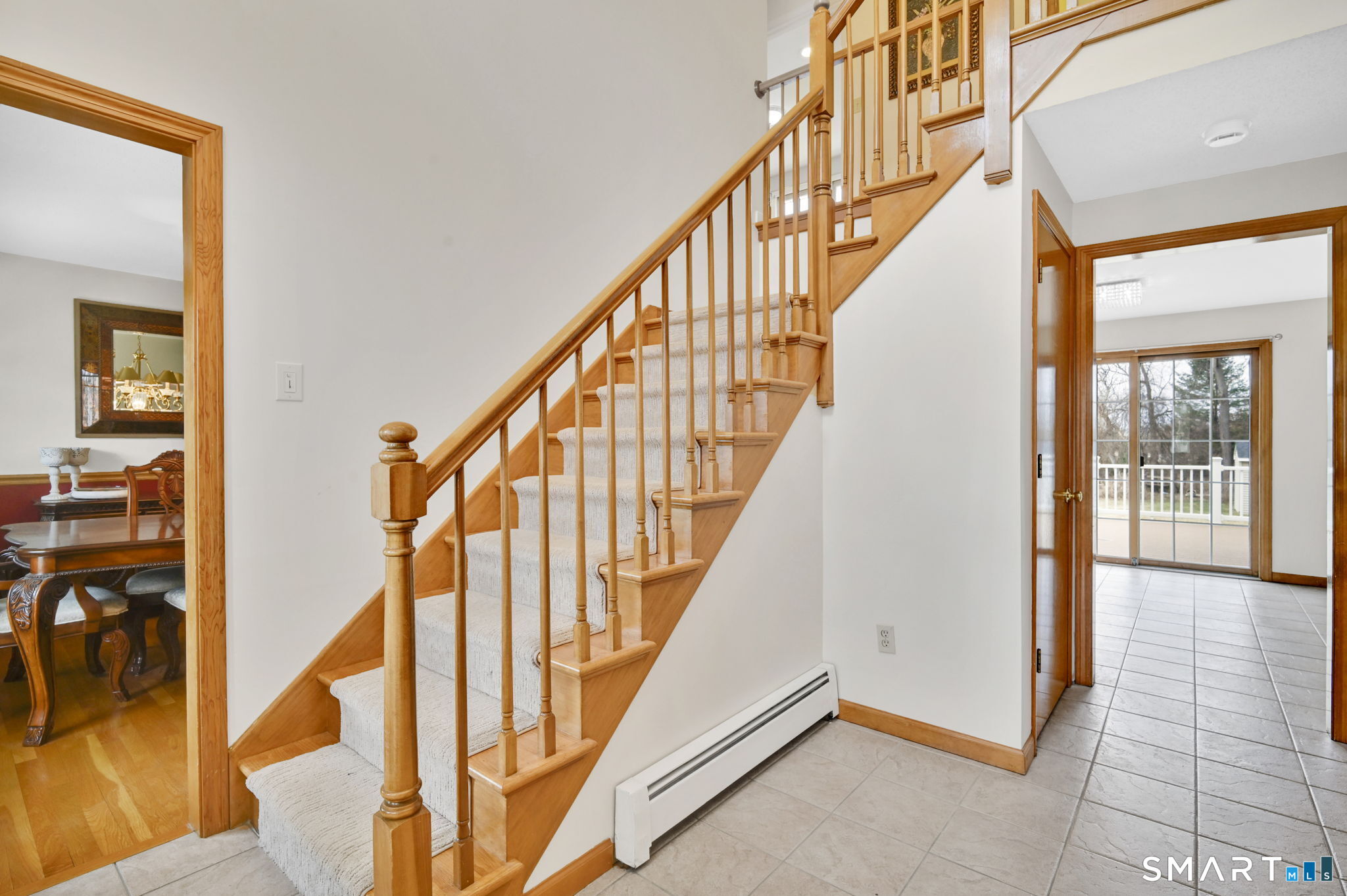 36 Cardinal Way South Windsor, CT 06074 - Photo 6 of 40 a view of staircase with lots of frames on wall and windows