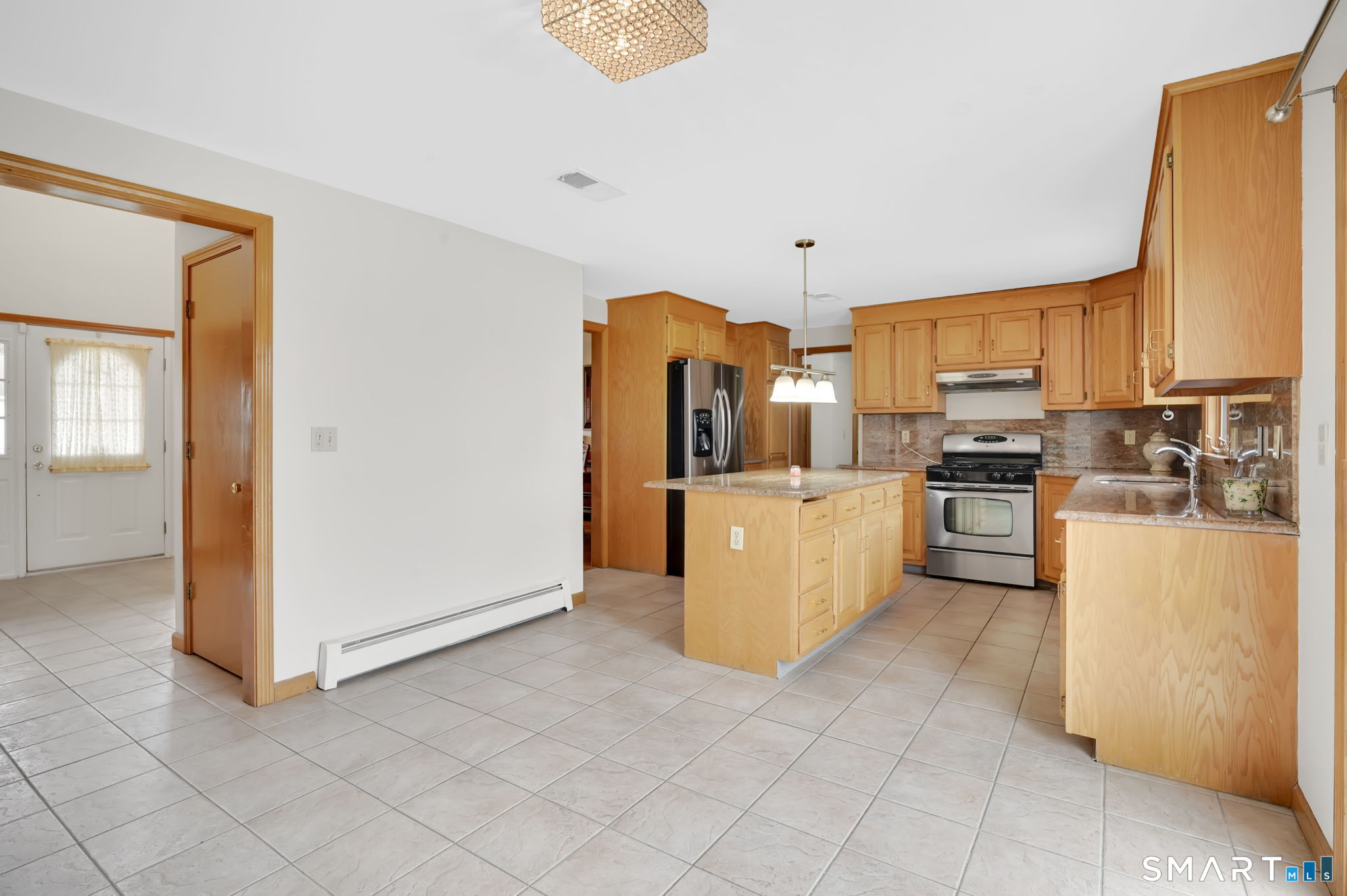 36 Cardinal Way South Windsor, CT 06074 - Photo 7 of 40 a kitchen with stainless steel appliances a refrigerator a stove a sink and white cabinets