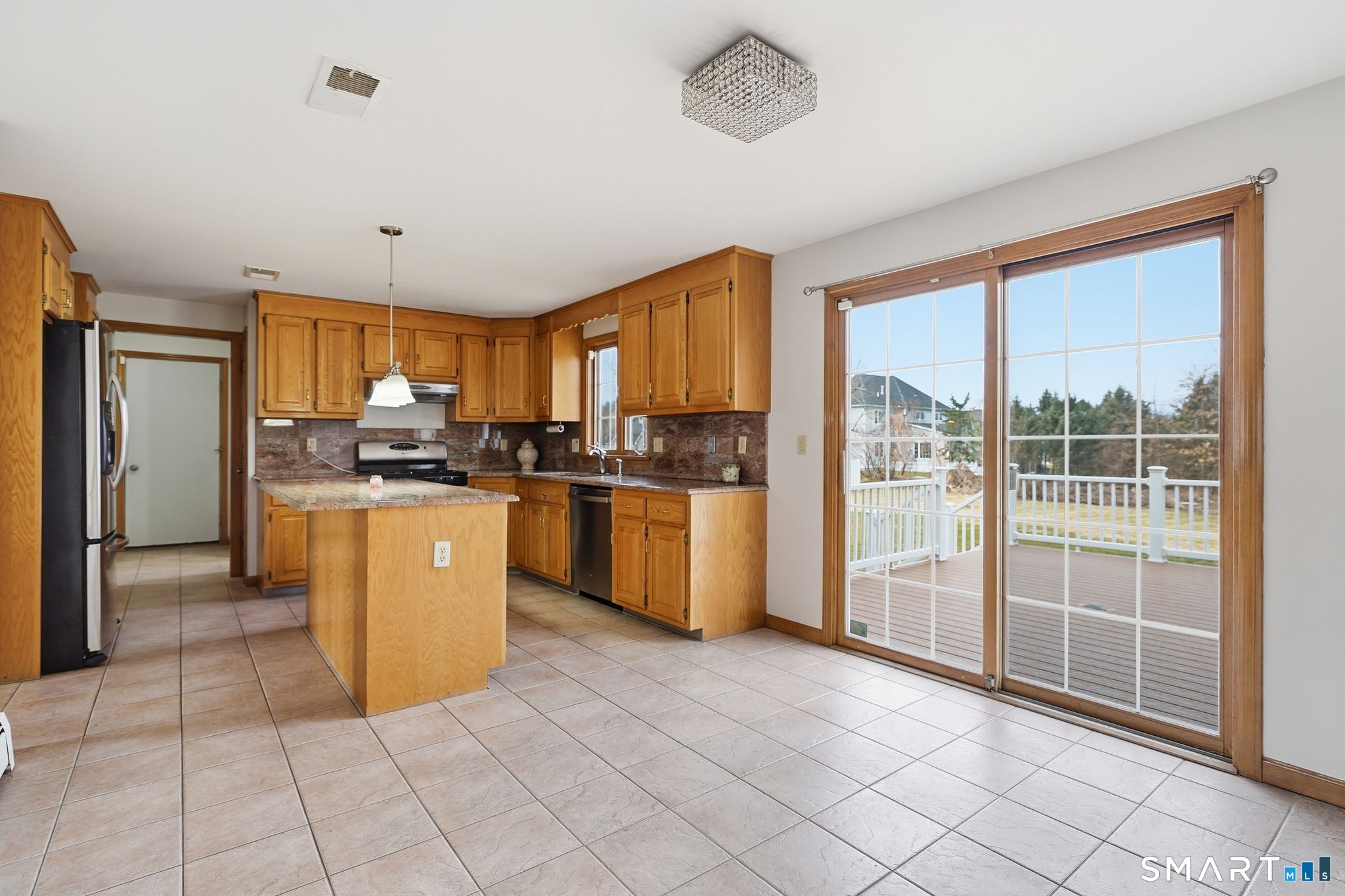 36 Cardinal Way South Windsor, CT 06074 - Photo 8 of 40 a kitchen with stainless steel appliances granite countertop a refrigerator a sink a stove top oven and cabinets