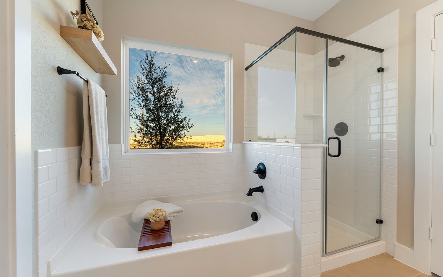 7224 Fairlawn Drive Fairview, TN 37062 - Photo 10 of 25 a bathroom with a bathtub a shower and a window