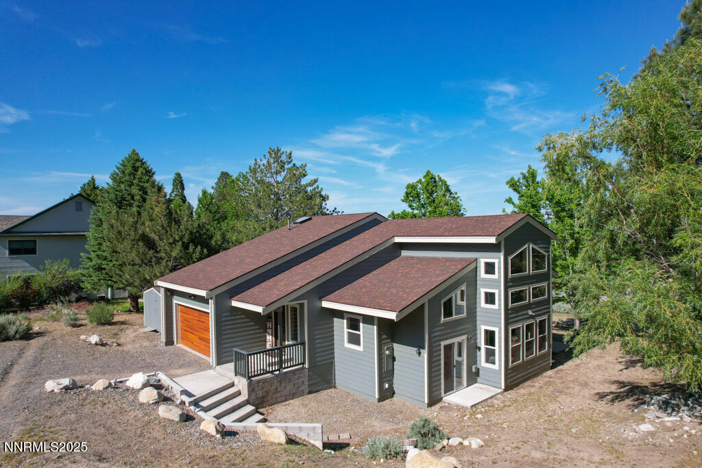 1147 Autumn Hills Road Gardnerville, NV 89460 - Photo 2 of 50 a front view of a house with a yard