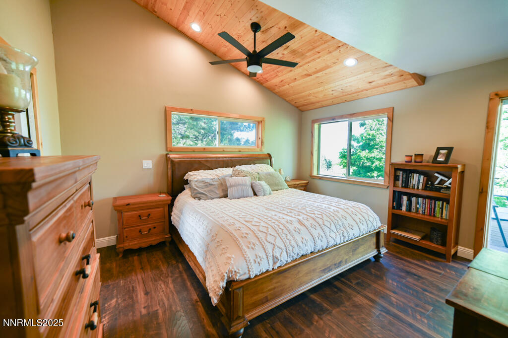 1147 Autumn Hills Road Gardnerville, NV 89460 - Photo 28 of 50 a bedroom with a bed bookshelf and a large window