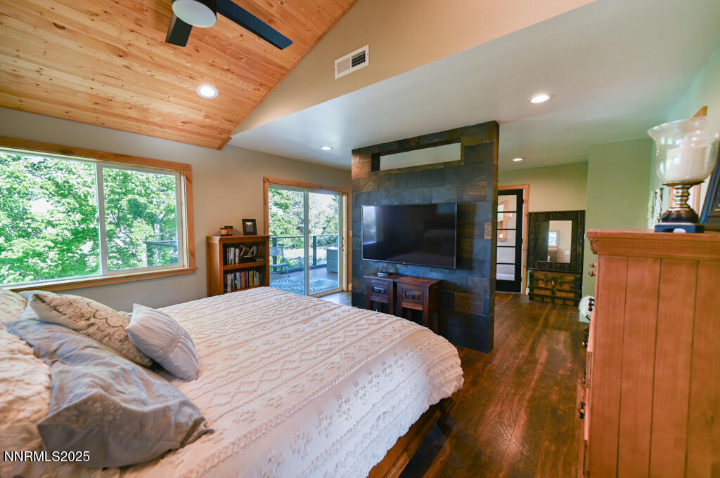 1147 Autumn Hills Road Gardnerville, NV 89460 - Photo 29 of 50 a bedroom with a bed and a flat screen tv