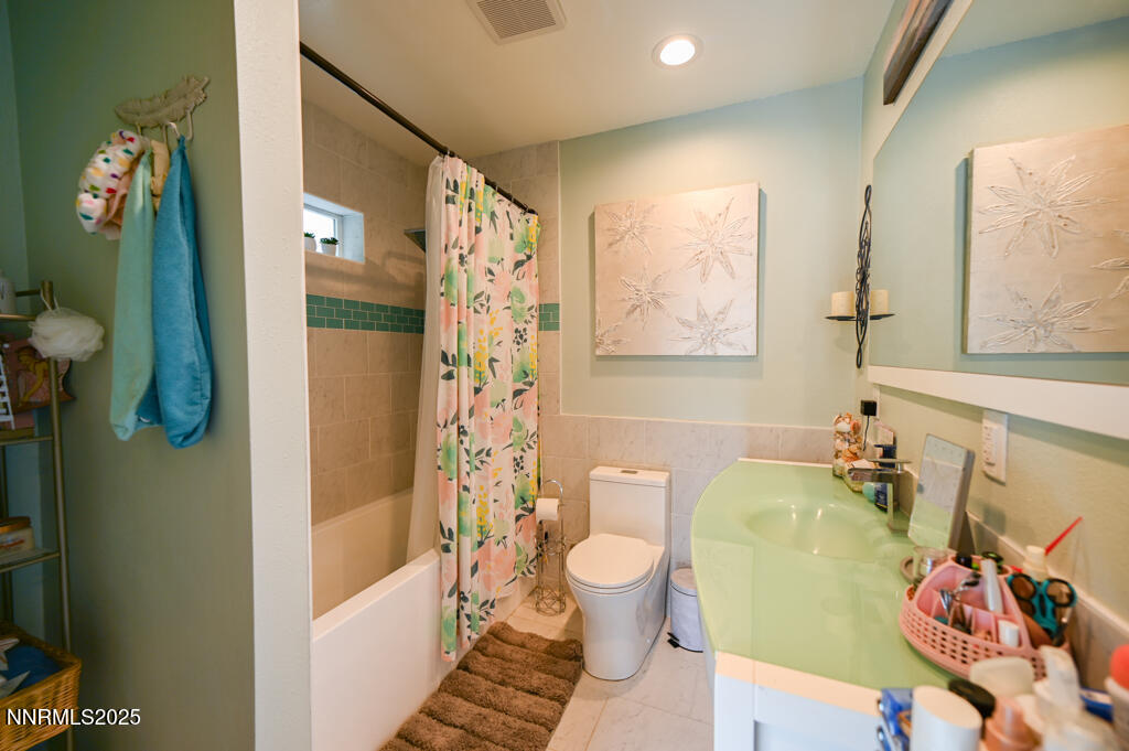 1147 Autumn Hills Road Gardnerville, NV 89460 - Photo 39 of 50 a bathroom with a sink toilet and shower