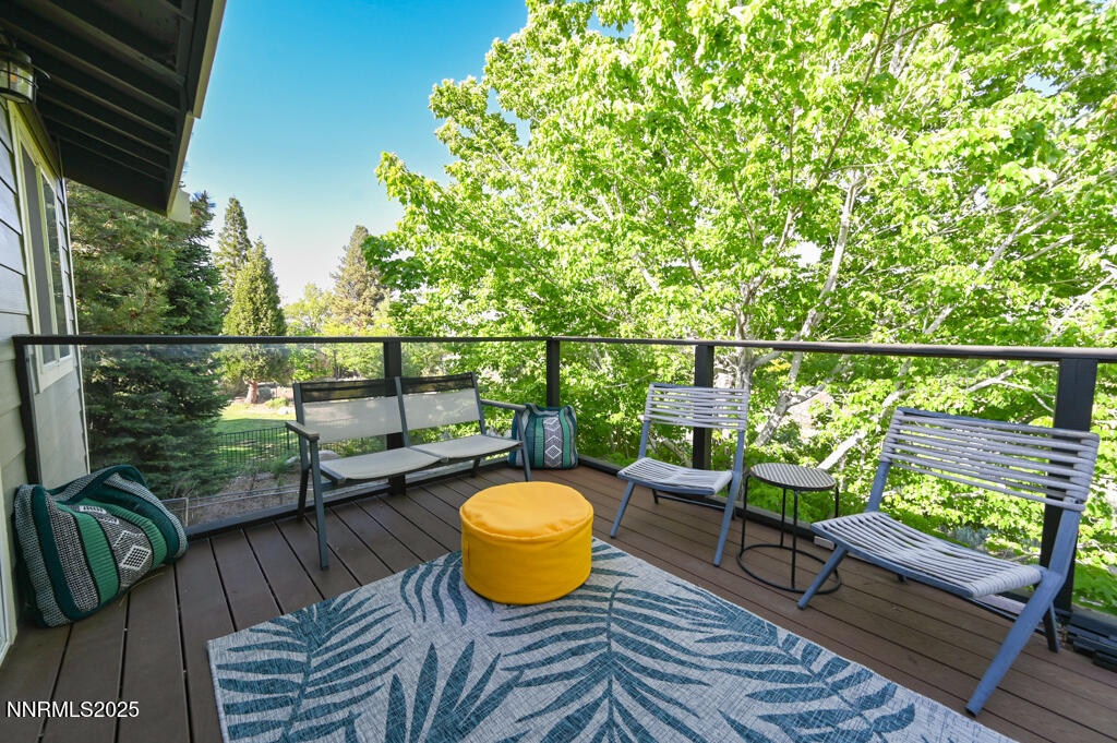 1147 Autumn Hills Road Gardnerville, NV 89460 - Photo 40 of 50 a view of a chairs and table on the deck