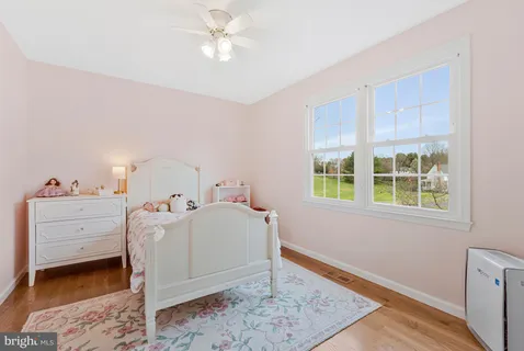 a bed room with a bed and a window