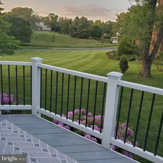 a view of a deck with a floor to ceiling window yard and outdoor view