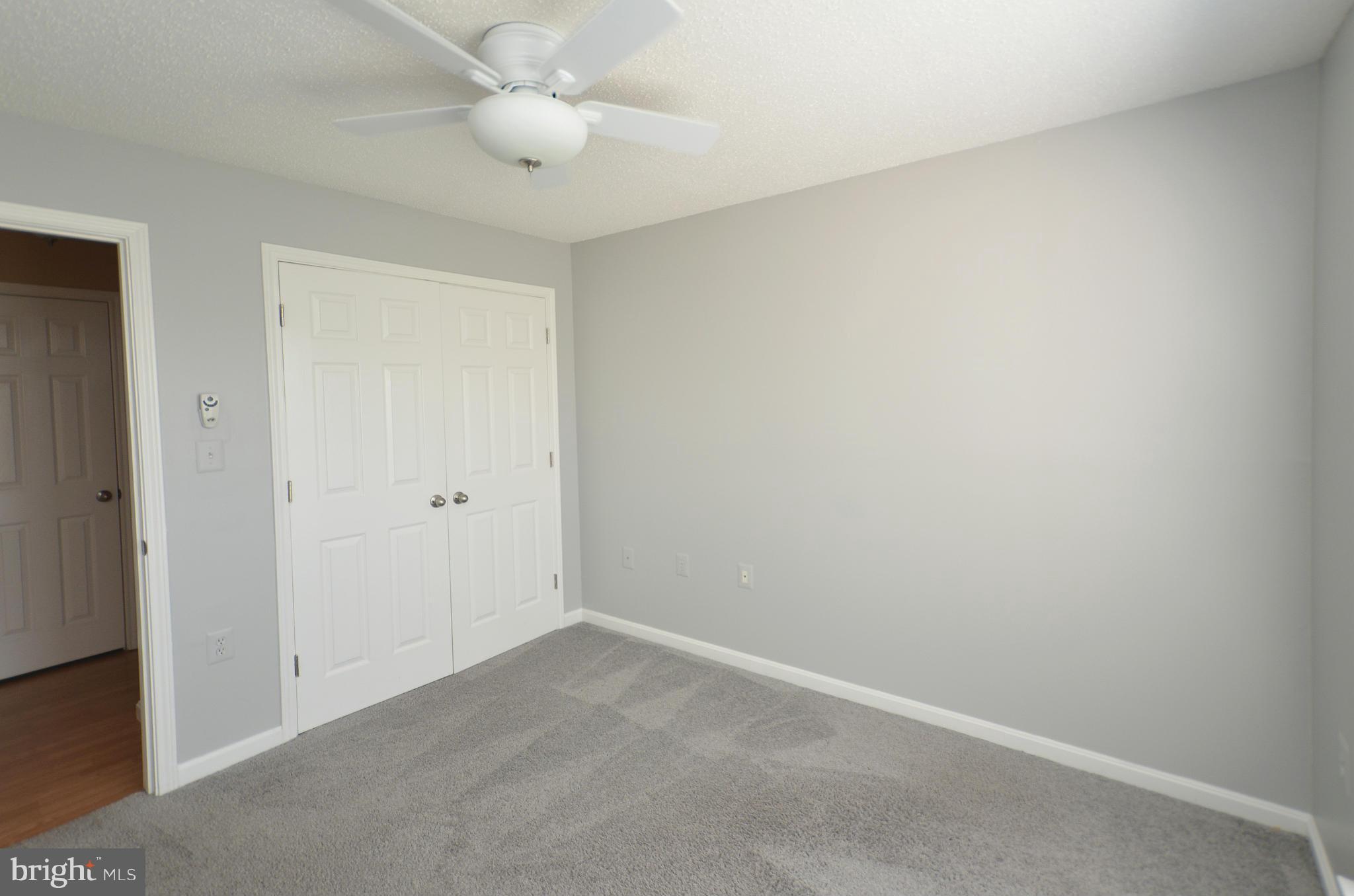 21019 Timber Ridge Terrace, Unit 302 Ashburn, VA 20147 - Photo 22 of 27 wooden floor in an empty room